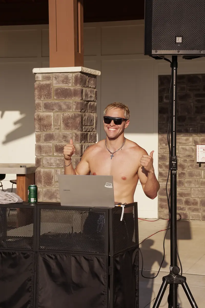 DJ giving a thumbs up at the Fitzroy Grove pool party